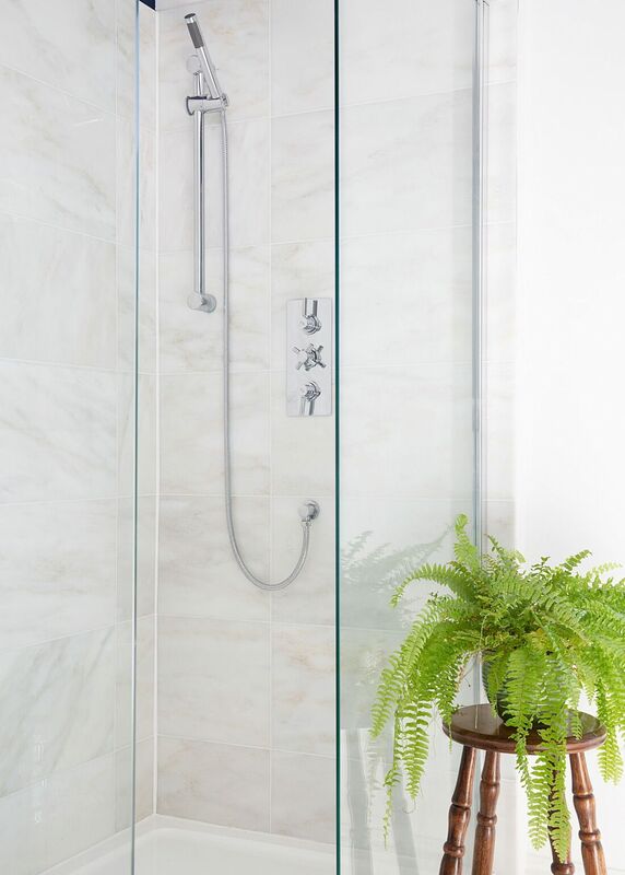 white marble walk in frameless shower