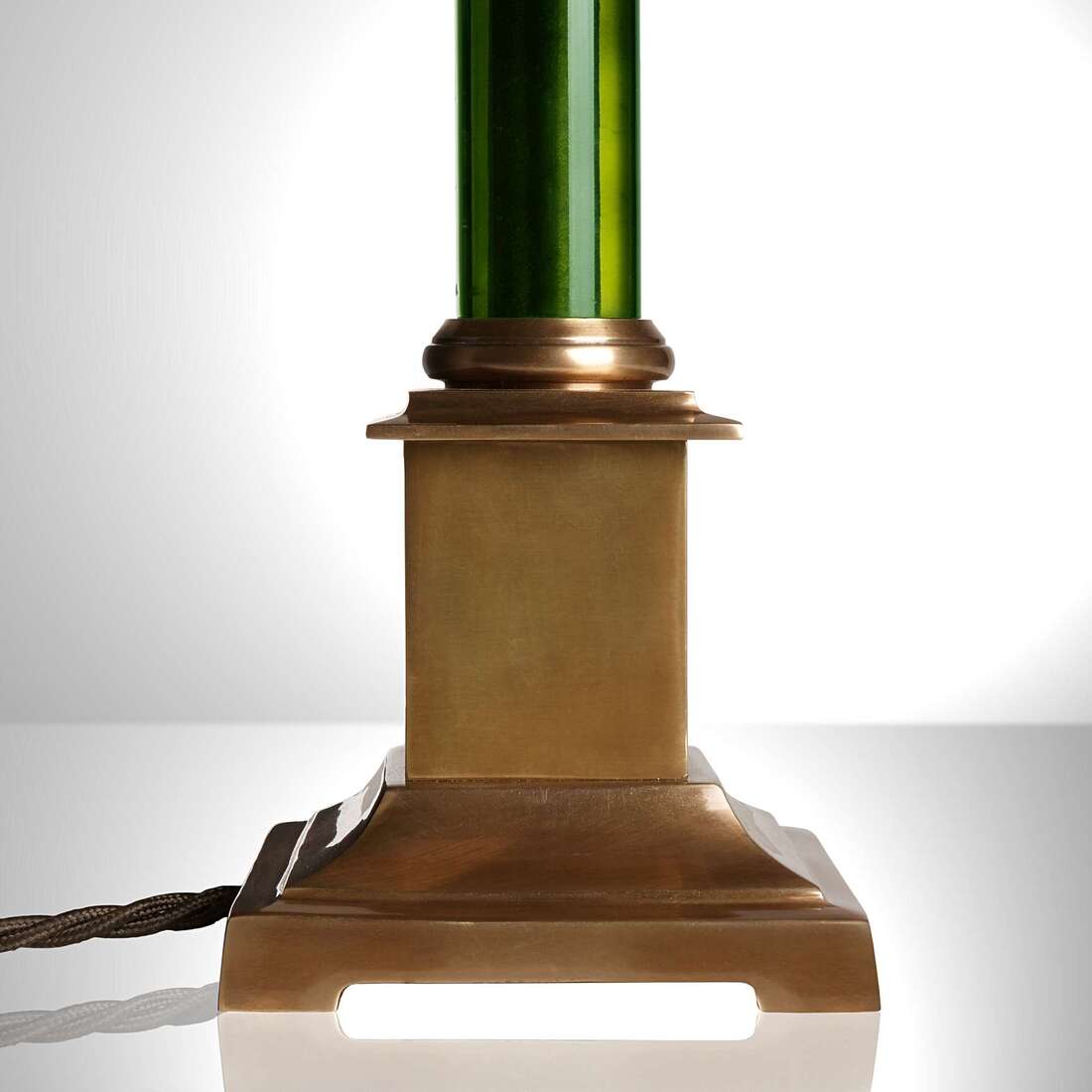 the longford lamp with brass and green resin base.