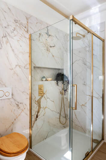 large format tiled shower with storage niche