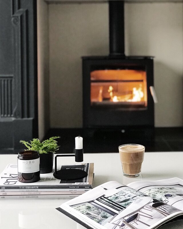 monochrome living space with log burner