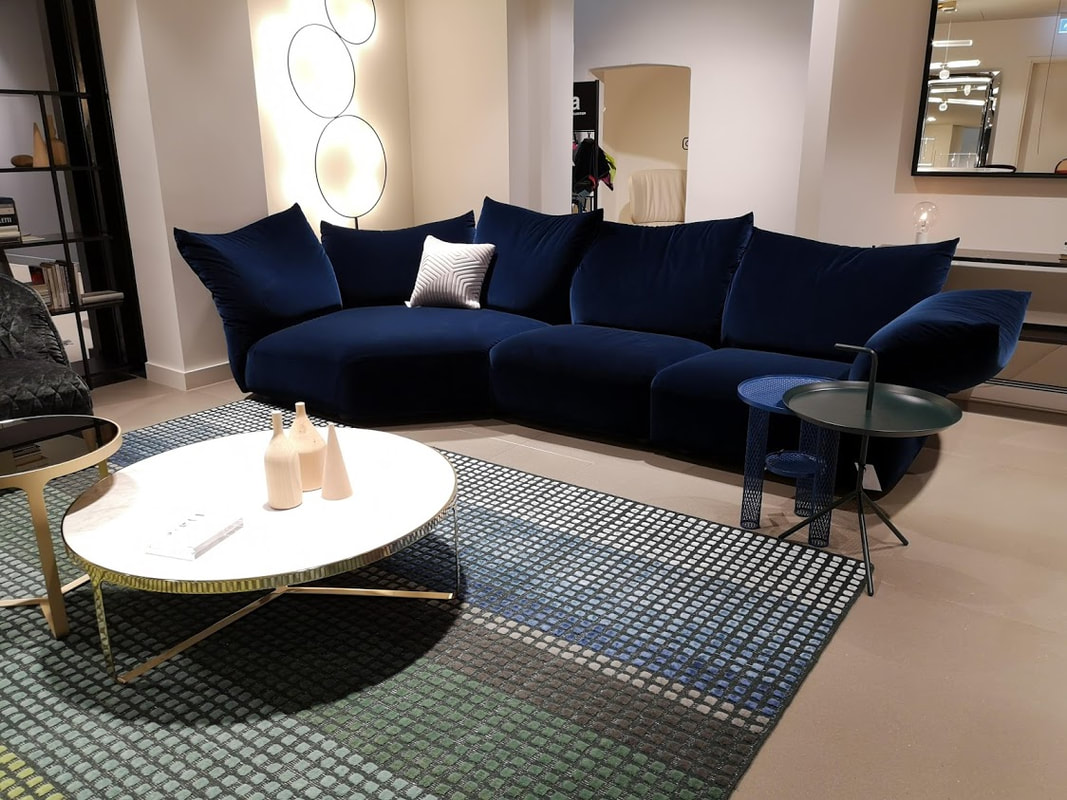 a sumptuous blue velvet sofa