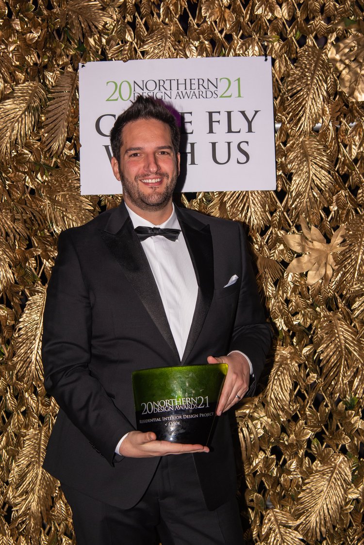 Peter Grech of The SpaceMaker Interiors holding the Norther Design Awards trophy 2021
