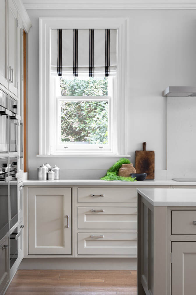 Striped relaxed window blind in a shaker kitchen