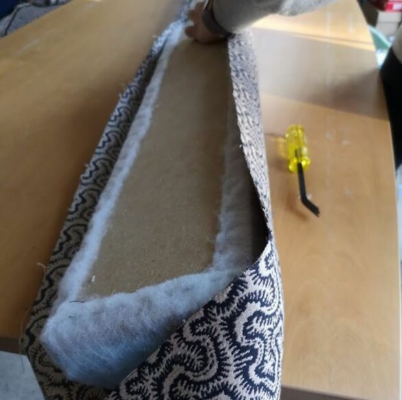 upholstering carefully, upholstery bee is working from the centre outwards
