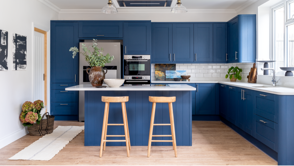 blue and white kitchen styled with accessories and greenery
