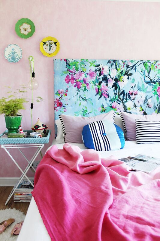 bold floral fabric and washed rose walls