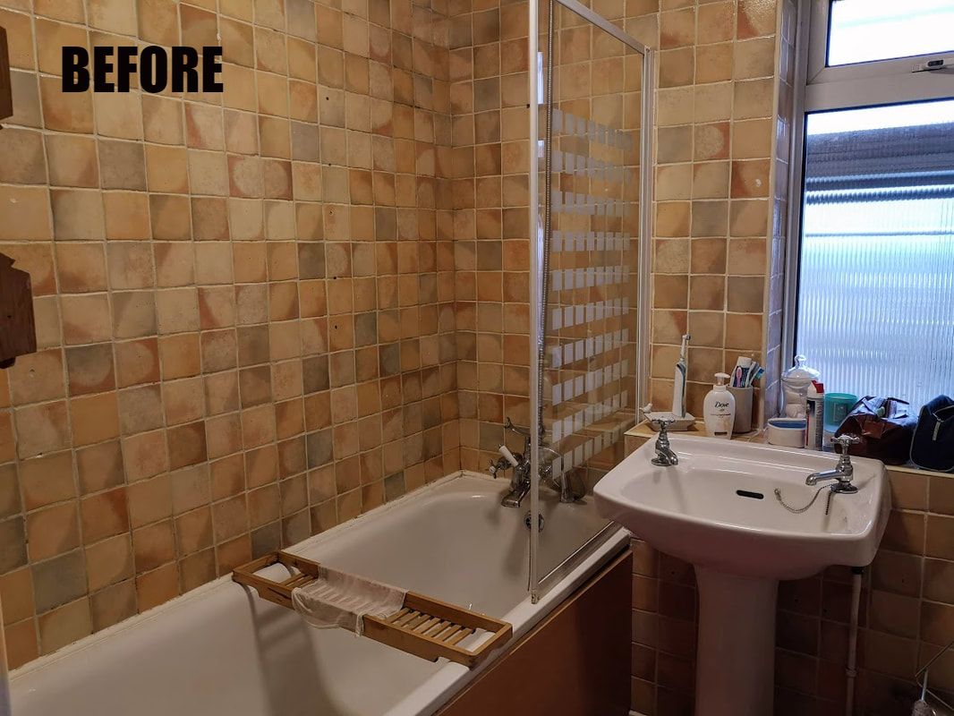 pre-renovation shot of a problem bathroom with old tiles, no storage and dark setting 