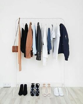 minimalist wardrobe with blues, whites, blacks and browns.