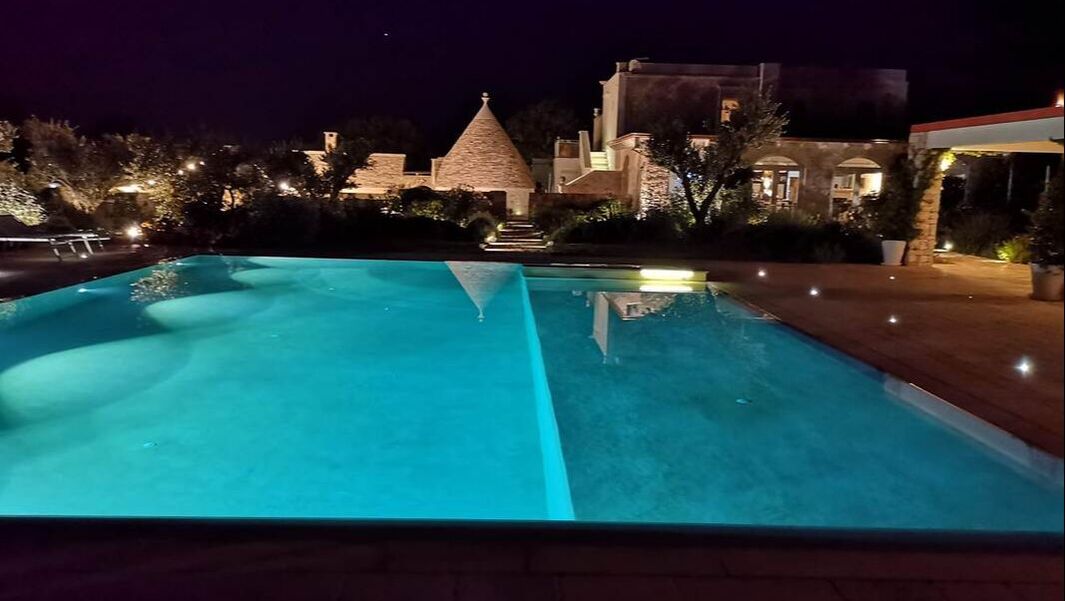leonardo trulli resort at night