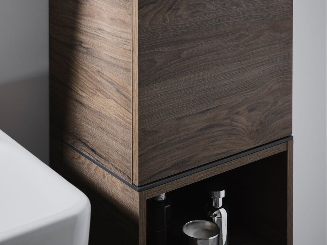 furniture detail shot of a wooden cabinet in a bathroom space by geberit