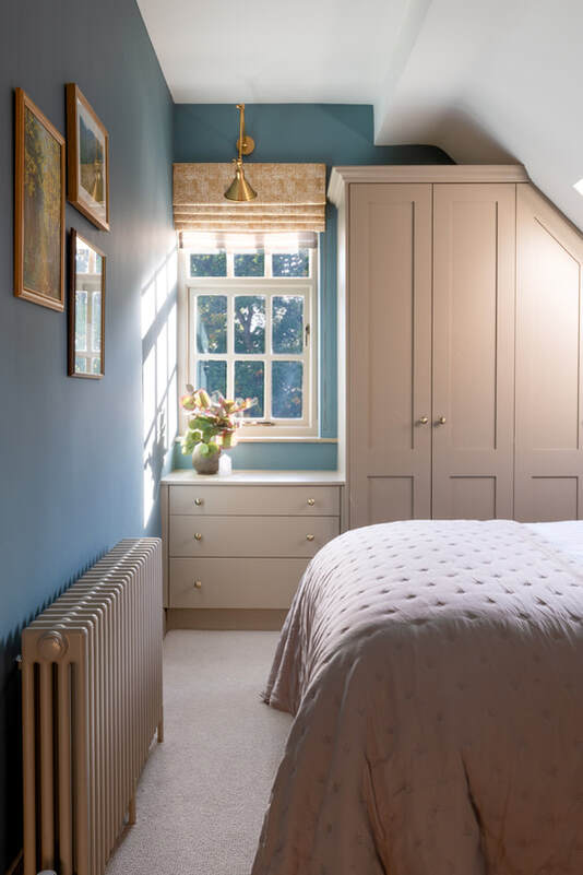 Attic bedroom in blue and taupe
