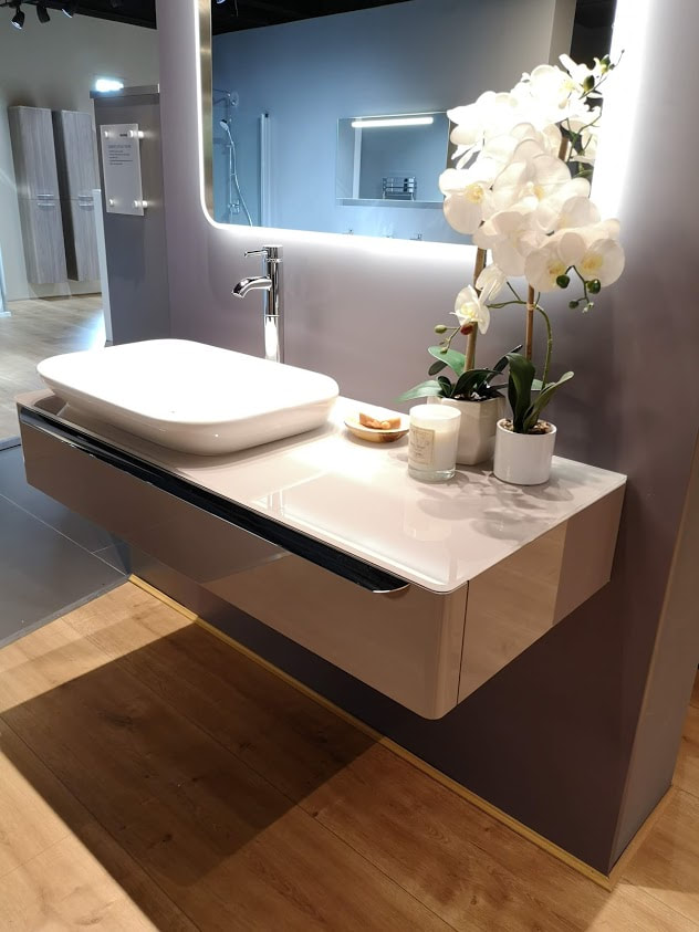 sink with back lit mirror from the geberit myday range on a taupe console