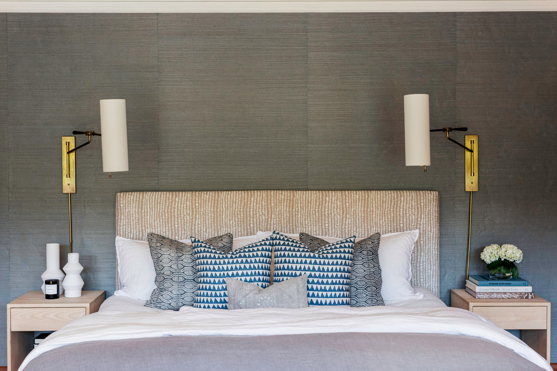 silk wallpaper with an upholstered headboard and soft neutrals