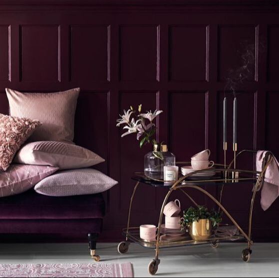 purple cushions and dark panelling