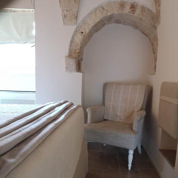 neutral decor inside a trullo in southern itay