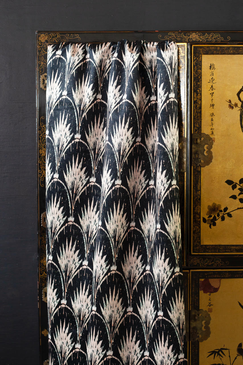 Pearl pattern on velvet by anna hayman draped over a cabinet.